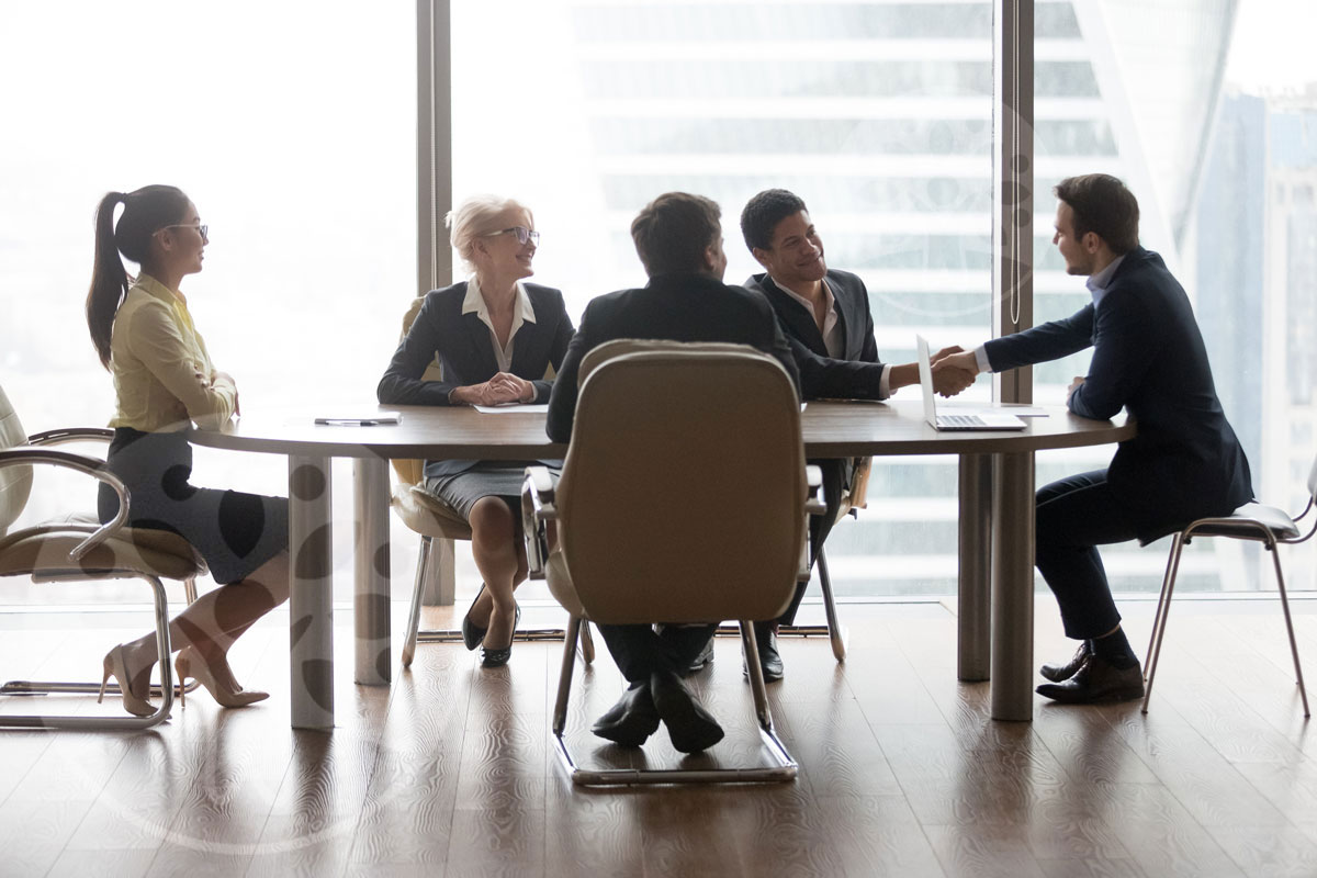 corporate lawyer shake hand with client