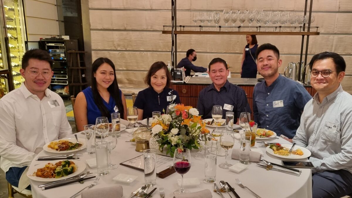 Clients gather around for a commemorative group photo at Yuen Law's Client Appreciation Dinner. Celebrating Yuen Law's 10th Year Anniversary. 